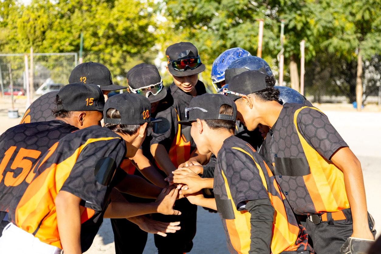 group of baseball players in a huddle.