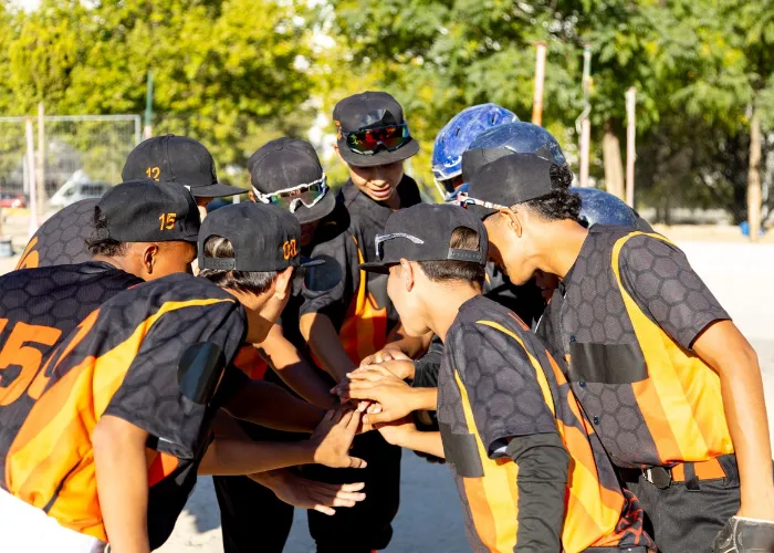 group of baseball players in a huddle.