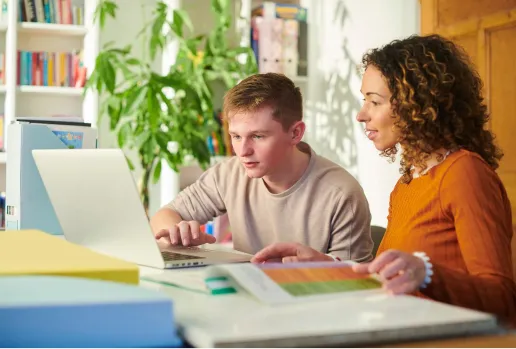 Boy working with tutor